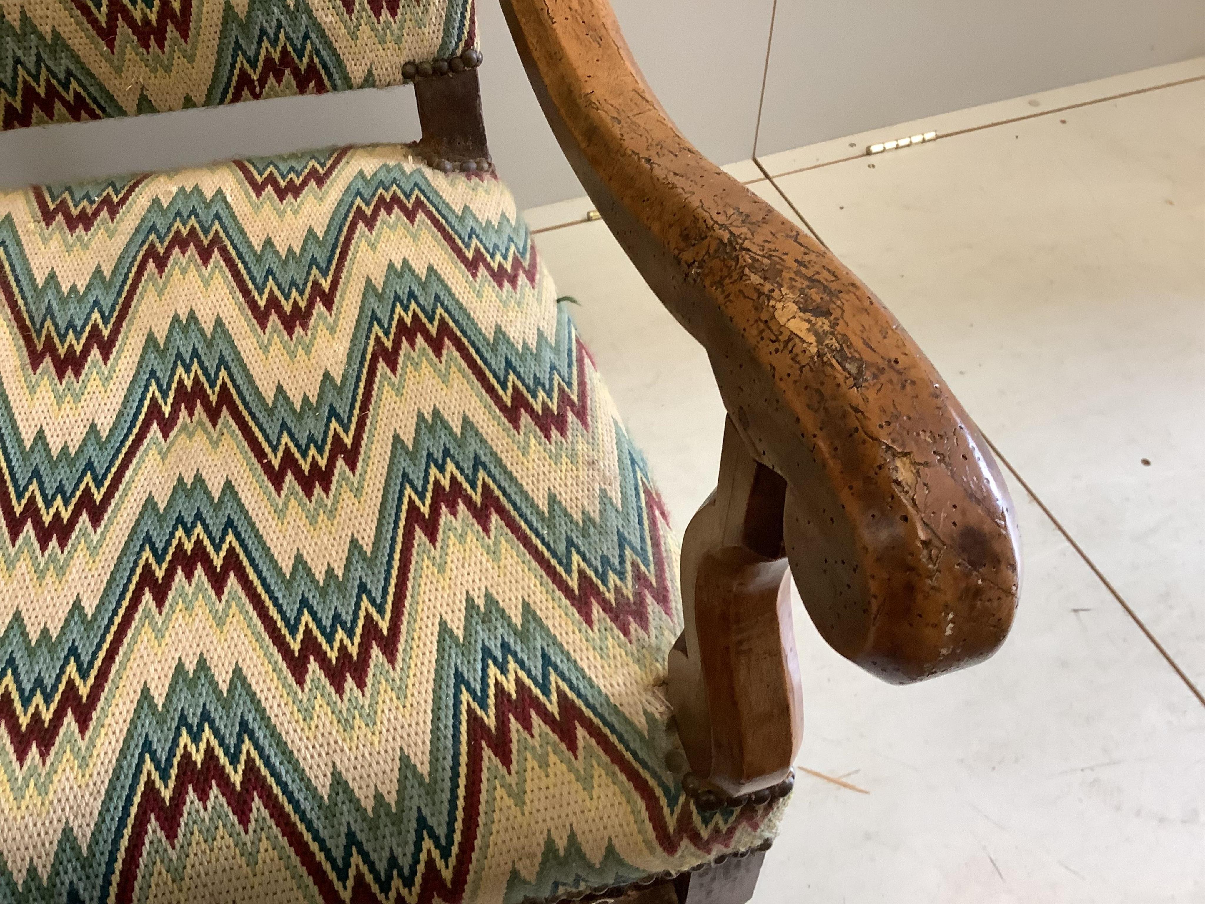 A 19th century French walnut armchair, in the 17th century style, width 64cm, height 116cm. Condition - heavily wormed, frame wobbling